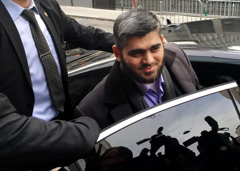 Jaish Al Islam leader Mohammed Alloush gets in to a car heading to a meeting with the High Negotiations Committee in Geneva on February 2, 2016. Bassem Mroue/AP Photo