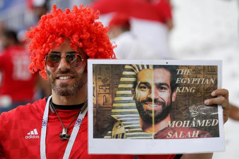An Egypt fan holds a poster supporting Egypt's Mohamed Salah prior to the group A match between Saudi Arabia and Egypt. Andrew Medichini / AP Photo