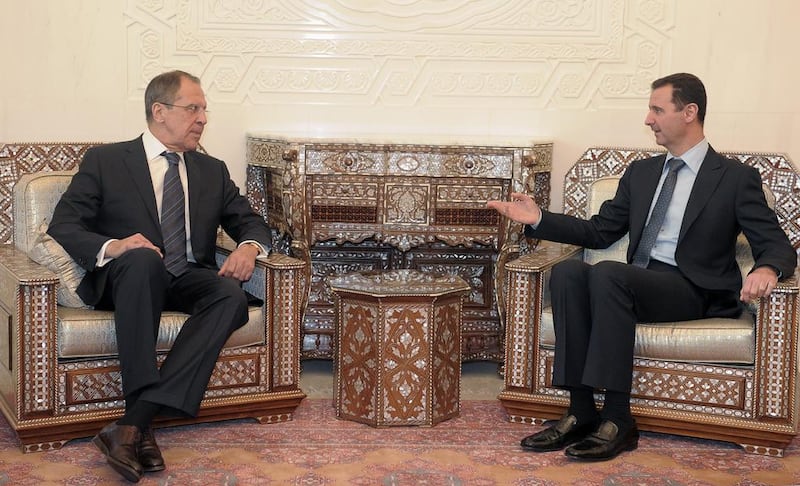 Syrian president Bashar Al Assad, right, with Russian foreign minister Sergey Lavrov in Damascus, in 2012. AP Photo