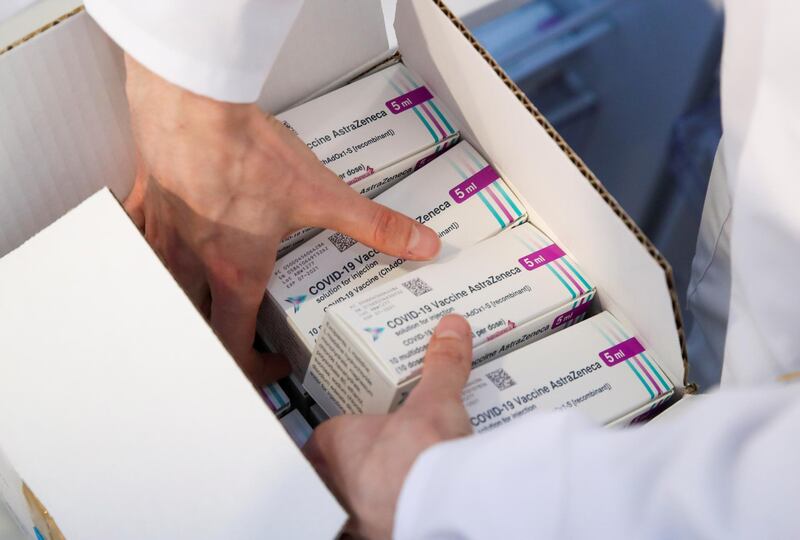 A medical worker unpacks a box of Oxford/AstraZeneca's COVID-19 vaccine at a vaccination centre in Bierset, Belgium March 17, 2021. REUTERS/Yves Herman