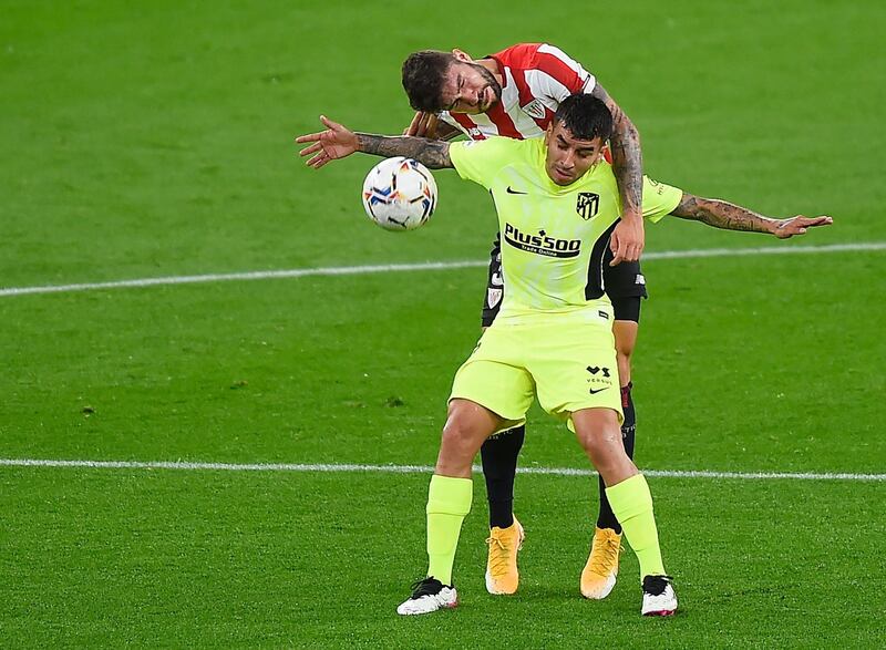 Atletico Madrid's Argentinian forward Angel Correa vies with Athletic Bilbao's Spanish defender Unai Nunez. AFP