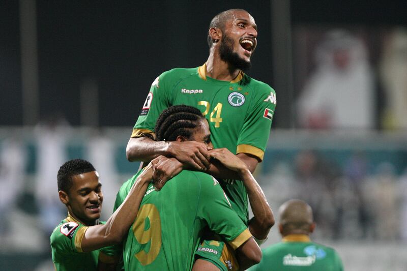 Dubai, United Arab Emirates, Nov 12, 2012 -  Essa Obaid (top) embrace  Edgar Bruno Da Silva (down) after the the third goal  against Al Shabab  against  Ajman at Shabab's Maktoum Bin Rashid Al Maktoum Stadium. ( Jaime Puebla / The National Newspaper )