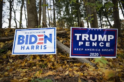 Campaign signs in support of Joe Biden, 2020 Democratic presidential nominee, and U.S. President Donald Trump in Pittsburgh, Pennsylvania, U.S., on Sunday, Nov. 1, 2020. After striding into the 2020 election year with a white-hot economy and beating Democratic efforts to remove him from office, Trump was ready to cruise to a second term. But then came the coronavirus pandemic and economic devastation. Photographer: Al Drago/Bloomberg