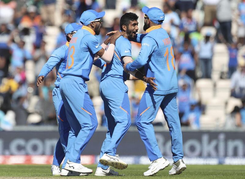 India's Jasprit Bumrah, second right, celebrates with teammates the dismissal of Afghanistan's Hashmatullah Shahidi during the Cricket World Cup match between India and Afghanistan at the Hampshire Bowl in Southampton, England, Saturday, June 22, 2019. (AP Photo/Aijaz Rahi)