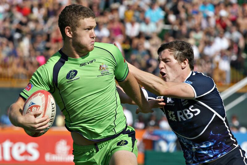 Dubai , United Arab Emirates, Dec 2 2011-Australia v Scotland- (left) Australia's #4 Lindsay Crook battles for his try as Scotland defender attempts to haul him down during action at the Emirates Airlenes Dubai Rugby Sevens. Mike Young / The National
