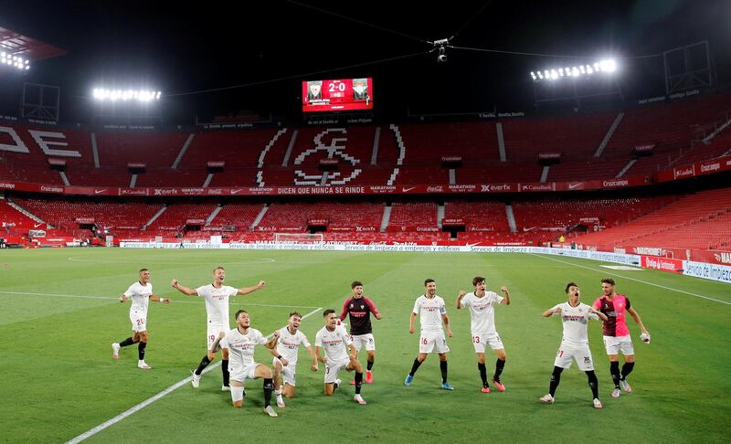 Sevilla players celebrate after the match. Reuters