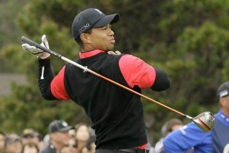 Tiger Woods lets go of his club after hitting from the 10th tee at Pebble Beach Golf Links during the final round of the AT&T Pebble Beach National Pro-Am golf tournament in Pebble Beach, Calif., Sunday, Feb. 12, 2012. (AP Photo/Eric Risberg) *** Local Caption *** Pebble Beach Golf.JPEG-04ac4.jpg