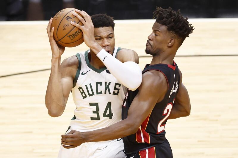 MIAMI, FLORIDA - MAY 27: Giannis Antetokounmpo #34 of the Milwaukee Bucks drives to the basket against Jimmy Butler #22 of the Miami Heat during the third quarter in Game Three of the Eastern Conference first-round playoff series at American Airlines Arena on May 27, 2021 in Miami, Florida. NOTE TO USER: User expressly acknowledges and agrees that, by downloading and or using this photograph, User is consenting to the terms and conditions of the Getty Images License Agreement.   Michael Reaves/Getty Images/AFP
== FOR NEWSPAPERS, INTERNET, TELCOS & TELEVISION USE ONLY ==
