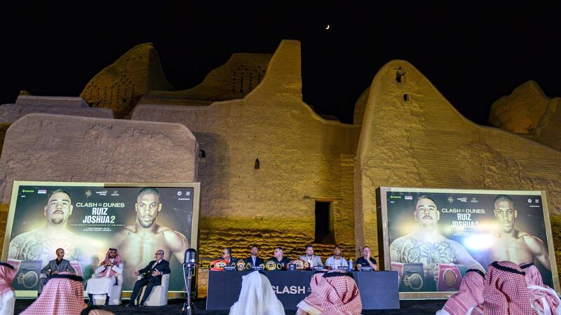 Andy Ruiz Jr, left, Eddie Hearn, centre, and Anthony Joshua during a press conference for "Clash on the Dunes". AFP