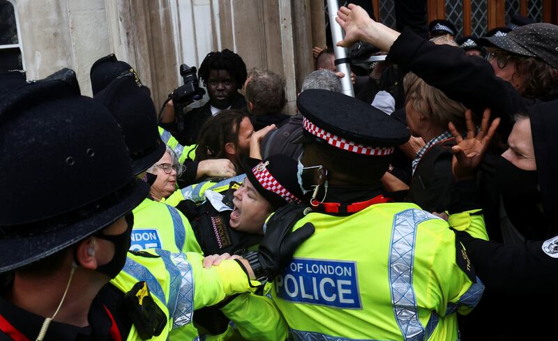 Police officers clash with Extinction Rebellion climate activists. Reuters