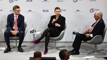 Danish Prime Minister Mette Frederiksen, centre, and Ukrainian Foreign Minister Dmytro Kuleba, left, at a panel discussion at the 60th Munich Security Conference in Munich on February 17, 2024. EPA