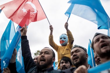 Turkish and Uighur protesters shout slogans as they hold flags during a protest against China after prayers at Fatih Mosque in Istanbul, Turkey, 06 November 2018. EPA