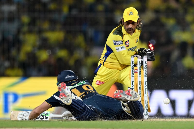 Chennai Super Kings' wicketkeeper MS Dhoni attempts to stump out Gujarat Titans' David Miller. AFP