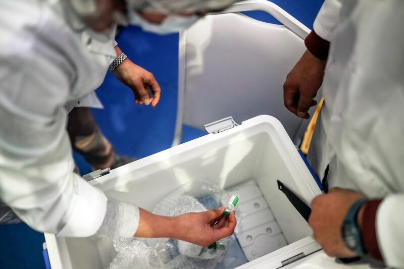 A health worker prepares doses of the AstraZeneca-Oxford Covid-19 vaccine in Rabat. AP Photo