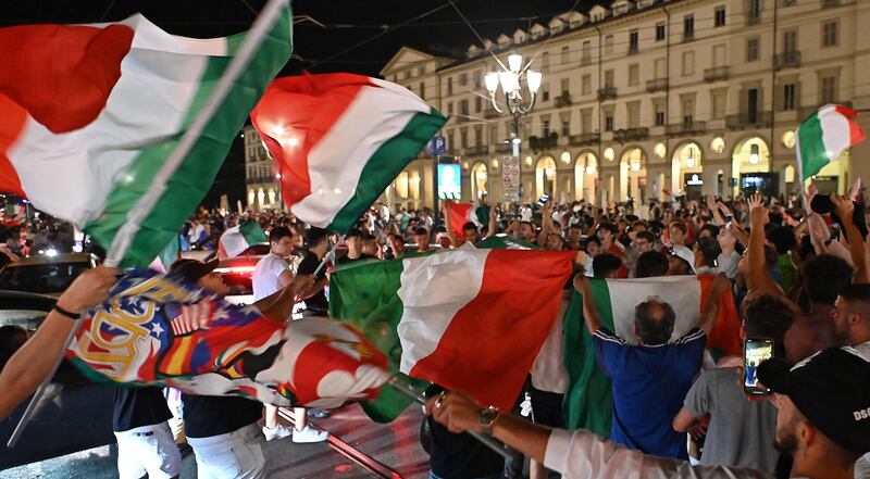 Italy fans celebrate in Turin.