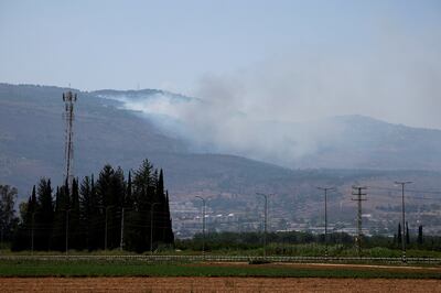 Smoke rises from fires near Kiryat Shmona in northern Israel after Hezbollah fired rockets and missiles at the area on Friday. Reuters