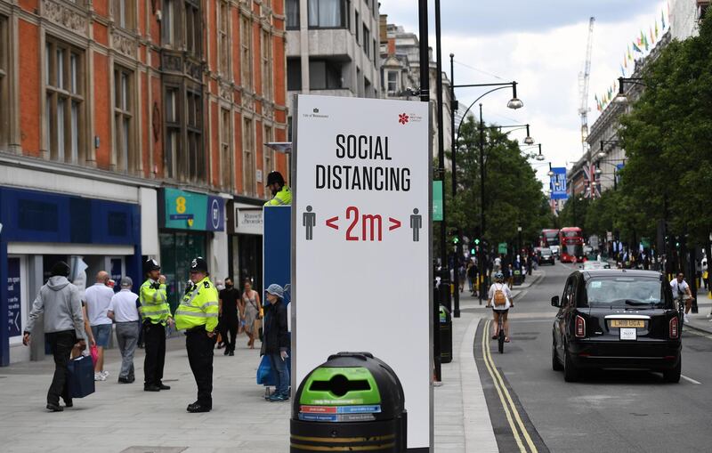 A view of a large sign reminding of two meters social distancing on Oxford Street in London, Britain, 15 June 2020.  EPA