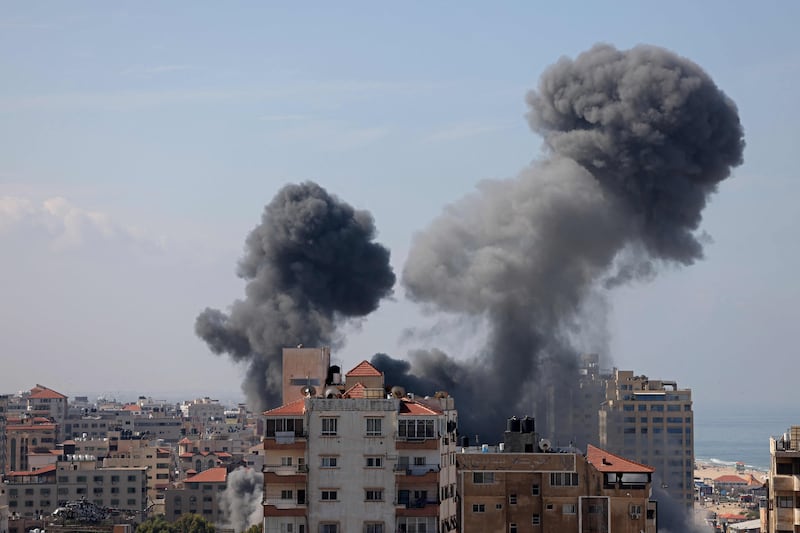 Smoke billows from a residential building following an Israeli airstrike in Gaza City. AFP
