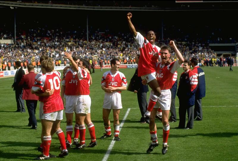 1993: Ian Wright and Andy Linighan celebrate with the Arsenal team after thir victory in the FA Cup Semi-Final against Tottenham Hotspur at Wembley Stadium in London. Arsenal won the match 1-0.  \ Mandatory Credit: Allsport UK /Allsport/Getty Images