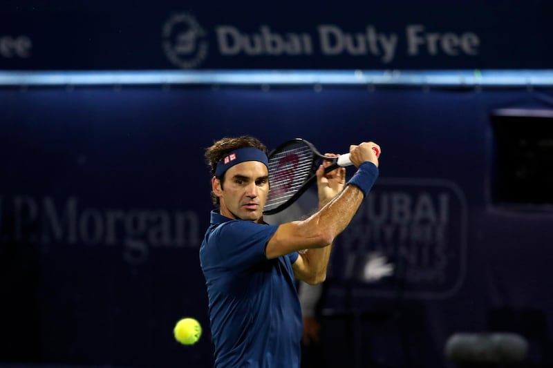 Federer keeps his eye on the ball as he plays a shot. AFP