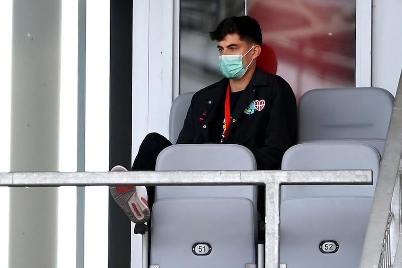 Bayer Leverkusen's Kai Havertz wearing a protective face mask, watches on from the stands. Reuters