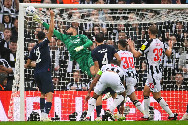 NEWCASTLE UPON TYNE, ENGLAND - OCTOBER 04: Gianluigi Donnarumma of Paris Saint-Germain saves the clearance of Manuel Ugarte of Paris Saint-Germain during the UEFA Champions League match between Newcastle United FC and Paris Saint-Germain at St. James Park on October 04, 2023 in Newcastle upon Tyne, England. (Photo by Stu Forster / Getty Images)