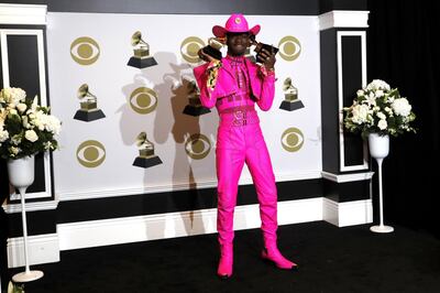 epa08169117 Lil Nas X poses in the press room with the Grammy for Best Pop Duo, and Best Music Video for 'Old Town Road' during the 62nd annual Grammy Awards ceremony at the Staples Center in Los Angeles, California, USA, 26 January 2020.  EPA/DAVID SWANSON