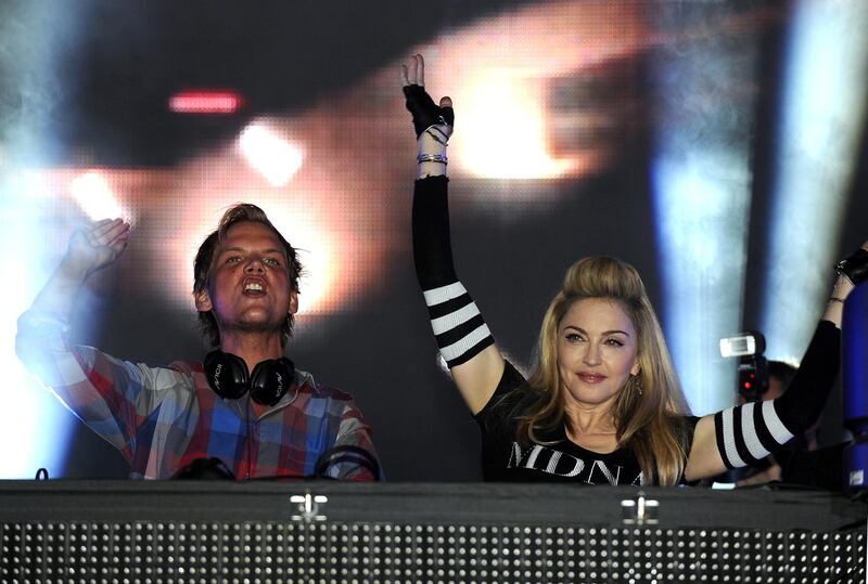 MIAMI, FL - MARCH 24: Avicii is joined by Madonna at Day Two of Ultra Music Festival 14 at Bayfront Park on March 24, 2012 in Miami, Florida. (Photo by Tim Mosenfelder/Getty Images)