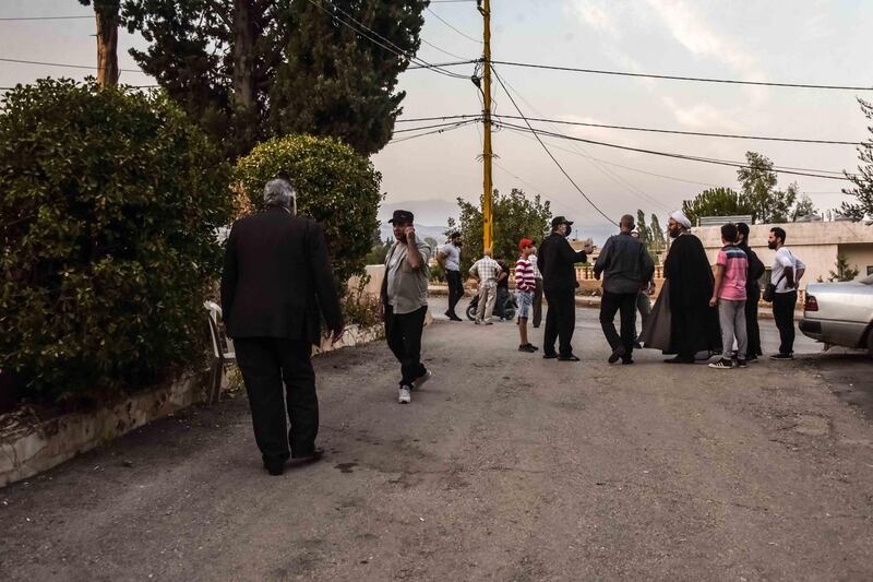 Bouday, Lebanon, 10 October 2020. Members of the Chamas clan investigating sounds of machine gun fire, thought to originate from the Noon family, following a clan meeting discussing regional response to the killing of family member, Mohammad Chamas by a member of the Jaafar family 4 October 2020. Elizabeth Fitt for The National