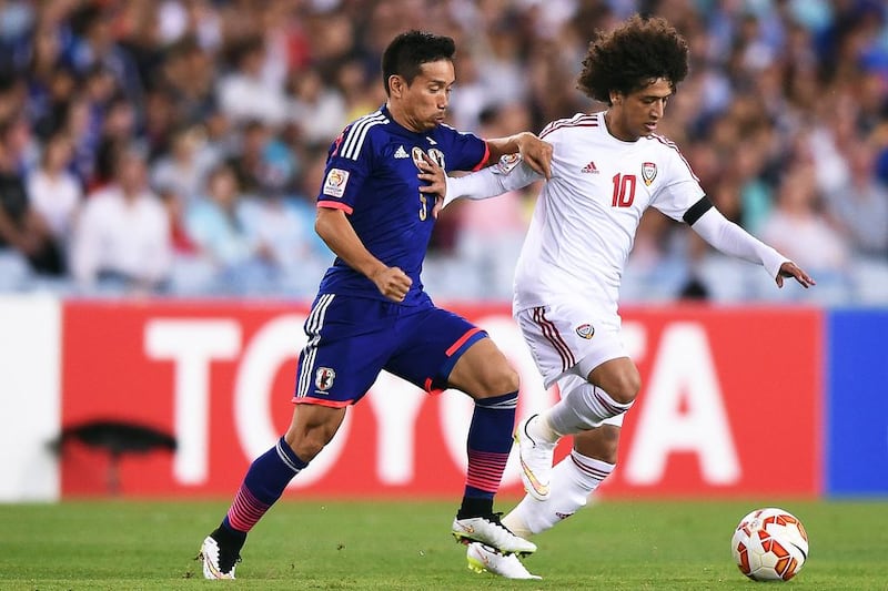 Yuto Nagatomo, left, of Japan in action against Omar Abdulrahman of the UAE during their Asian Cup quarter-final at Stadium Australia in Sydney on January 23, 2015. Paul Miller / EPA