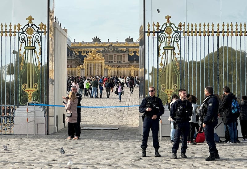 Tourists enter Versailles Palace after an evacuation order was lifted. Reuters