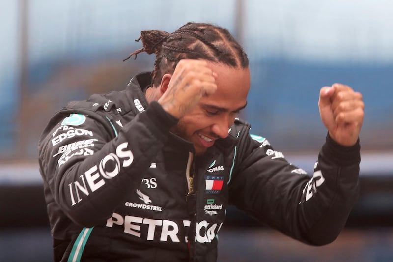 Mercedes driver Lewis Hamilton reacts after winning the 2020 Turkish Grand Prix and equalling Michael Schumacher's record of seven world titles. AP