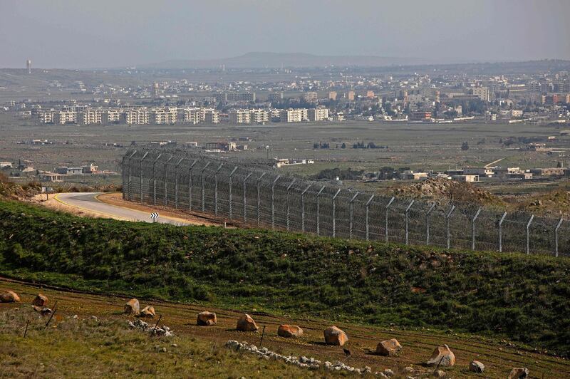 This picture taken from the Israeli-annexed Golan Heights on February 4, 2021, shows the border fence with the Syrian governorate of Quneitra. / AFP / JALAA MAREY
