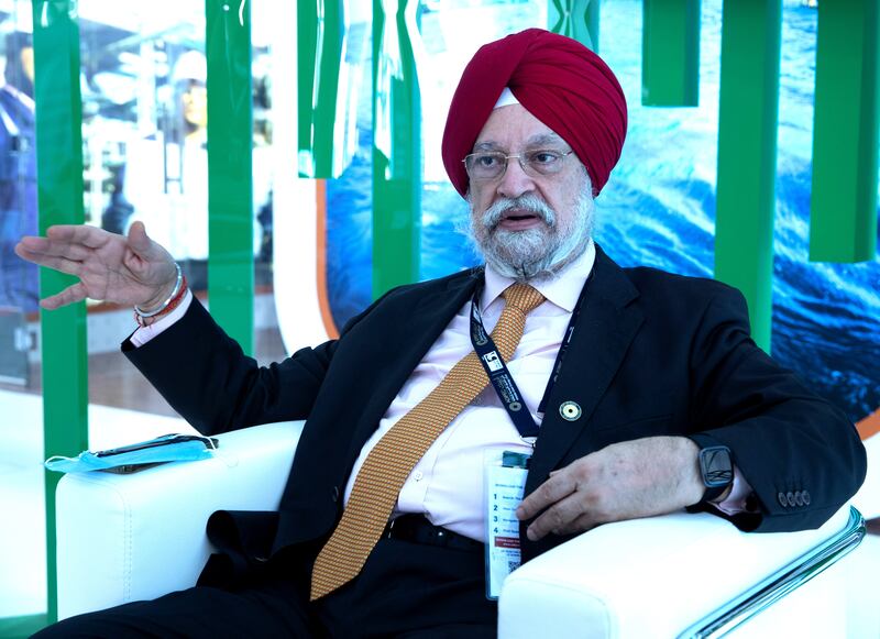 Hardeep Singh Puri, India's Petroleum Minister, said higher high fuel prices have hastened the transition to green energy. Victor Besa / The National