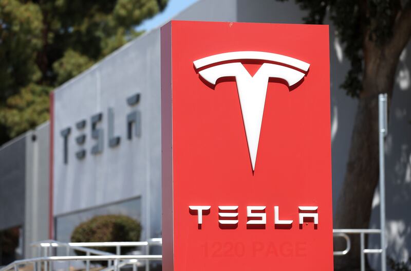 Tesla’s stock price is sinking amid a broader sell-off in equity markets around the world due to slower economic expansion and persistent inflation. Getty Images / AFP