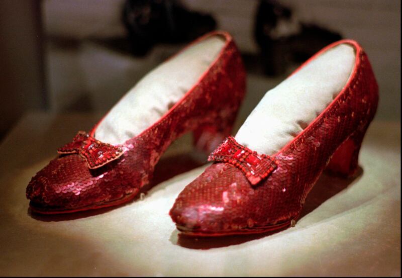 FILE - This April 10, 1996, file photo shows one of the four pairs of ruby slippers worn by Judy Garland in the 1939 film "The Wizard of Oz" on display during a media tour of the "America's Smithsonian" traveling exhibition in Kansas City, Mo. Federal authorities say they have recovered a pair of ruby slippers worn by Garland that were stolen from the Judy Garland Museum in Grand Rapids, Minn., in August 2005 when someone went through a window and broke into the small display case. The shoes were insured for $1 million. (AP Photo/Ed Zurga, File)