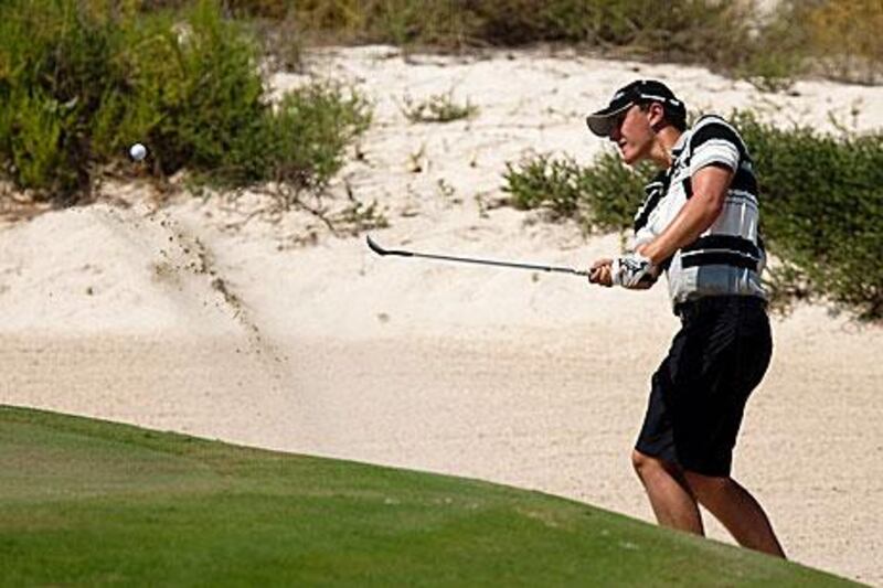 Daniel Owen wedges his way out of the bunker on the 17th hole of the first day of the Citizen Open.