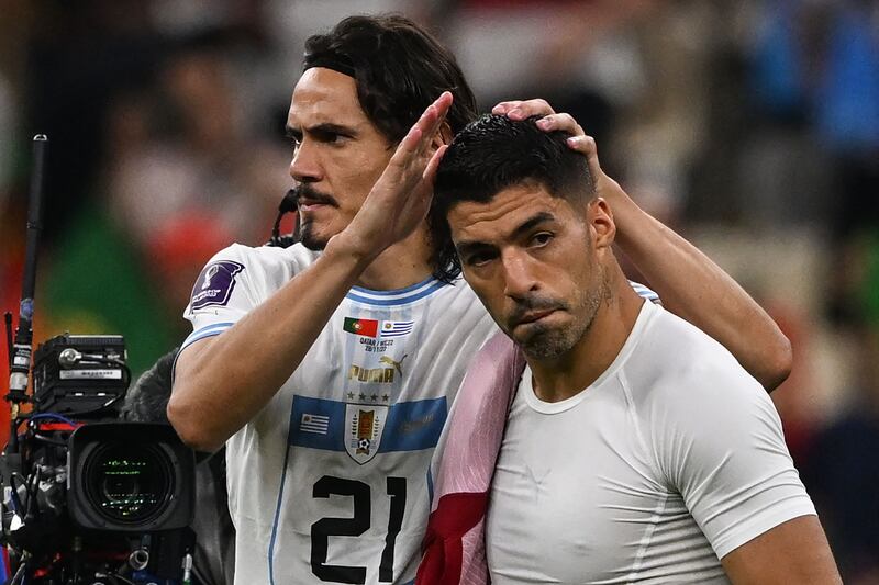 Uruguay's Edinson Cavani Luis Suarez look dejected after losing to Portugal. AFP