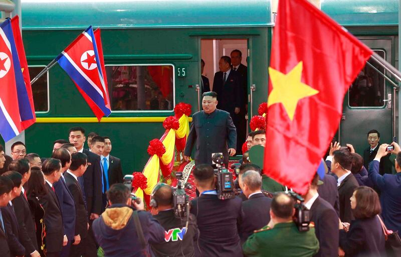 North Korean leader Kim Jong-un steps off the train to be welcomed at Dong Dang Railway Station. EPA