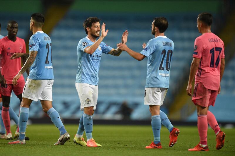 Manchester City's David Silva, left, with Manchester City's Bernardo Silva at the Etihad Stadium in Manchester. AP