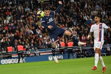 Paris Saint-Germain's Argentinian forward Mauro Icardi heads to score his team's second goal during the French L1 football match between Paris-Saint Germain (PSG) and Olympique Lyonnais at The Parc des Princes Stadium in Paris on September 19, 2021.  (Photo by Alain JOCARD  /  AFP)