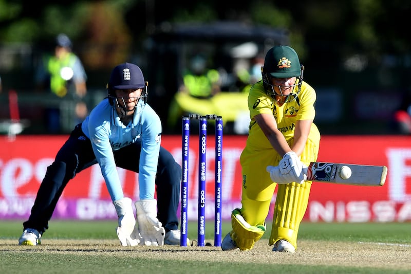 Alyssa Healy plays a shot watched by the England wicketkeeper Amy Jones. AFP