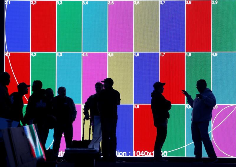 Technicians confer in front of a Hey Google booth at the Las Vegas Convention Center as they prepare for the 2018 CES in Las Vegas, Nevada. Steve Marcus / Reuters