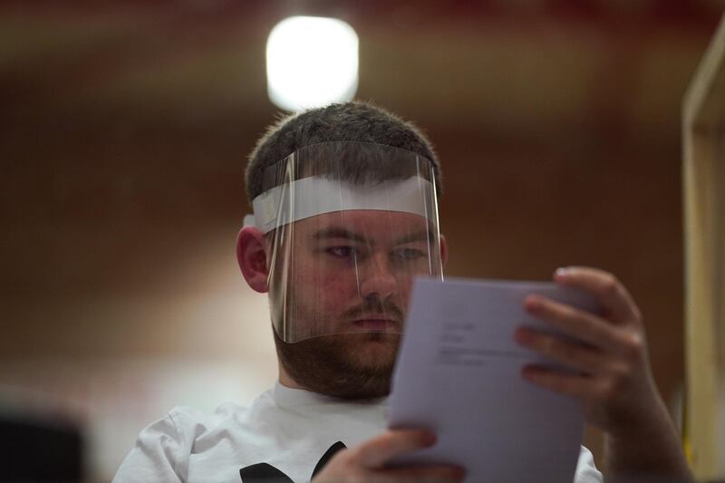 Polling station staff count votes at the Mill House Leisure. Getty Images