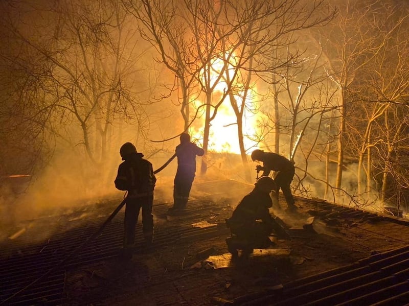 Rescuers work at the site of buildings damaged by shelling, as Russia's invasion of Ukraine continues, in Mykolaiv, Ukraine. Reuters