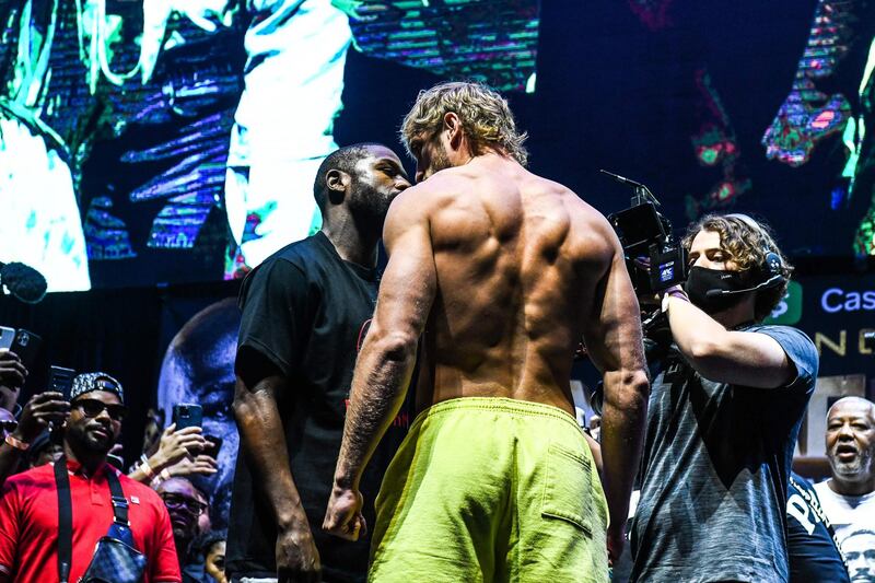 Former world welterweight champion Floyd Mayweather and Logan Paul face off. AFP