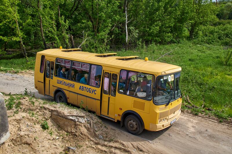 A school bus carrying Ukrainian refugees leaves Kharkiv. EPA