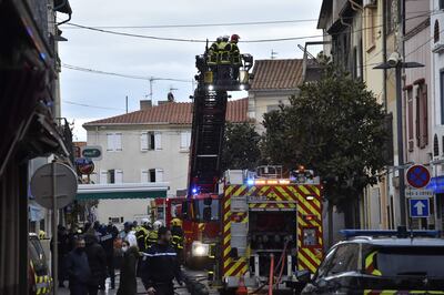 Firefighters at a building in Saint Laurent de la Salaque where an explosion and fire occurred in the early hours of Monday. AFP