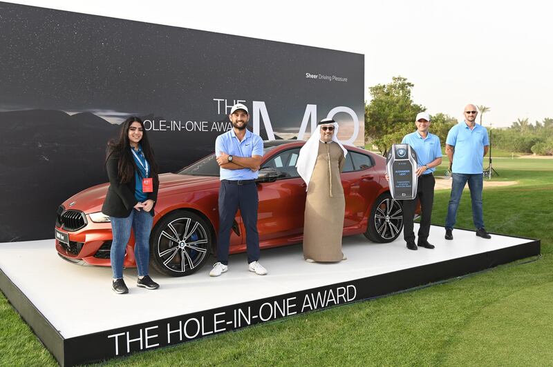 Alexander Levy poses for a photograph as he is presented with the BMW hole in one award during Day Three of the Abu Dhabi HSBC Championship. Getty Images