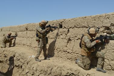Afghan security forces take position during a battle with the Taliban in Kunduz province, Afghanistan. Reuters